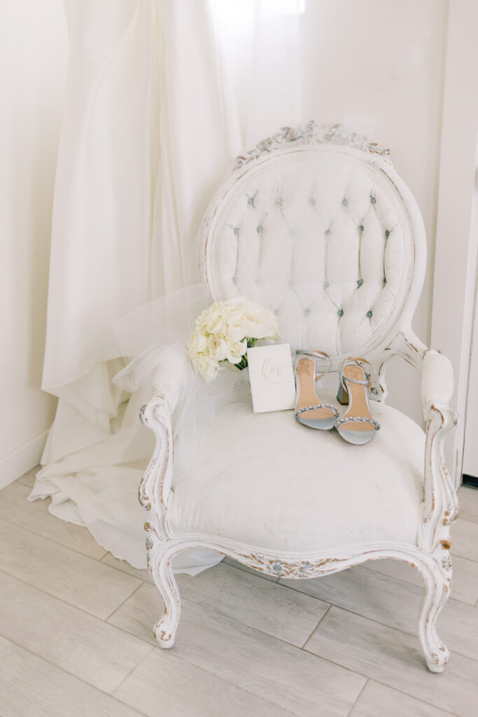 Bridal details, wedding gown, shoes, bouquet, and vow book. Tuscan Rose Ranch