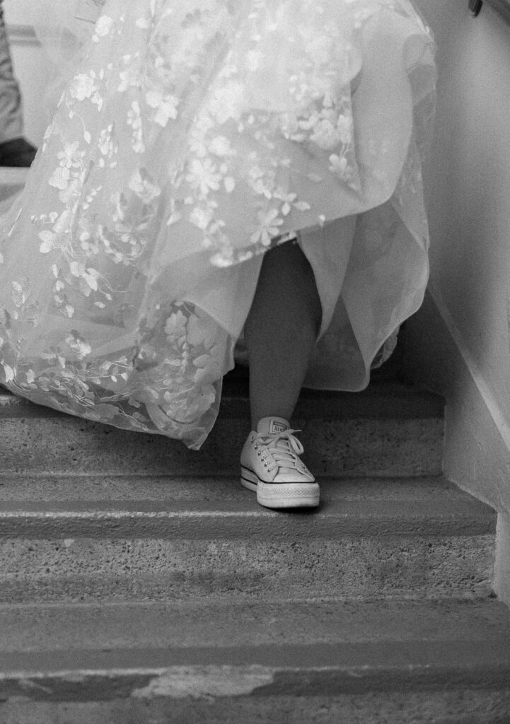 bride's shoe as she walks down the stairs.