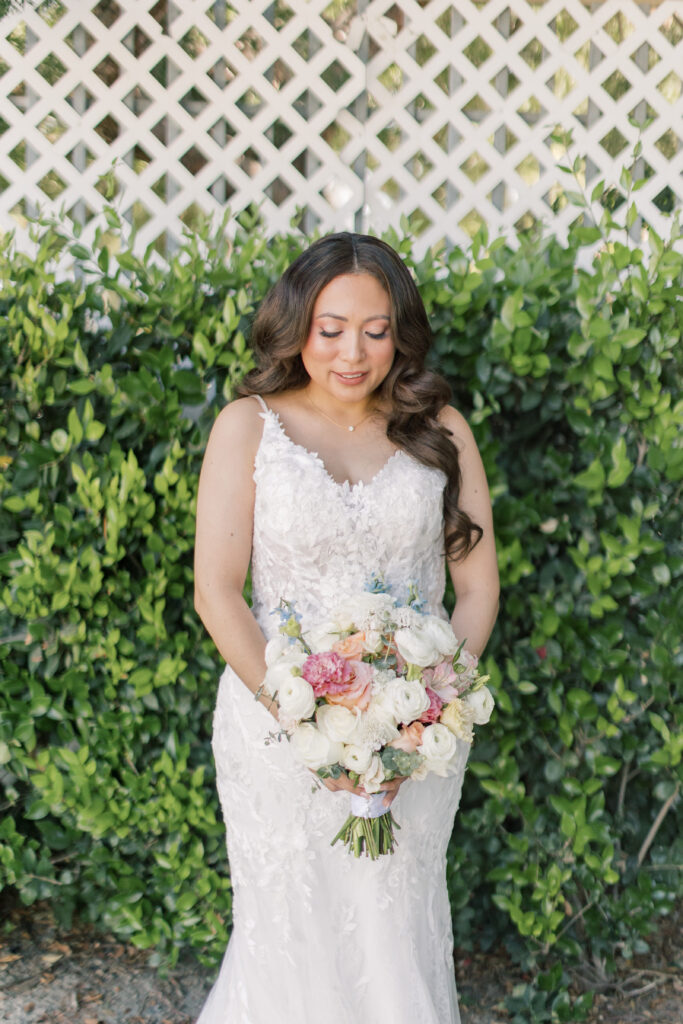 Bride looking down at her bouquet