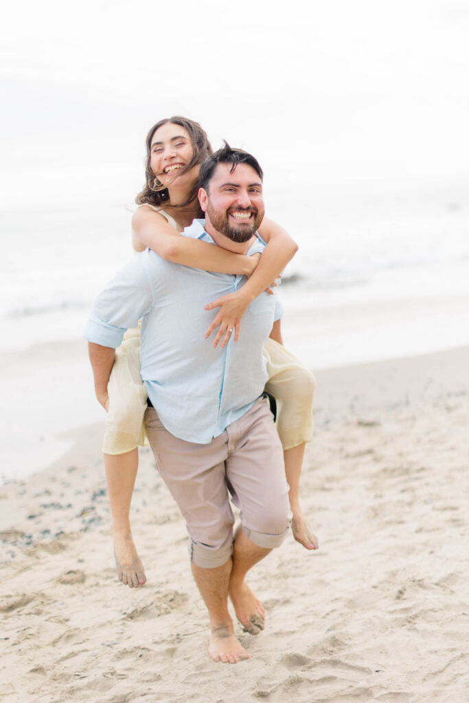 Couple walking on the sand of El Matador State Beach