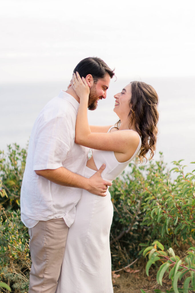 Couple at the top of a cliff at El Matador State Beach
