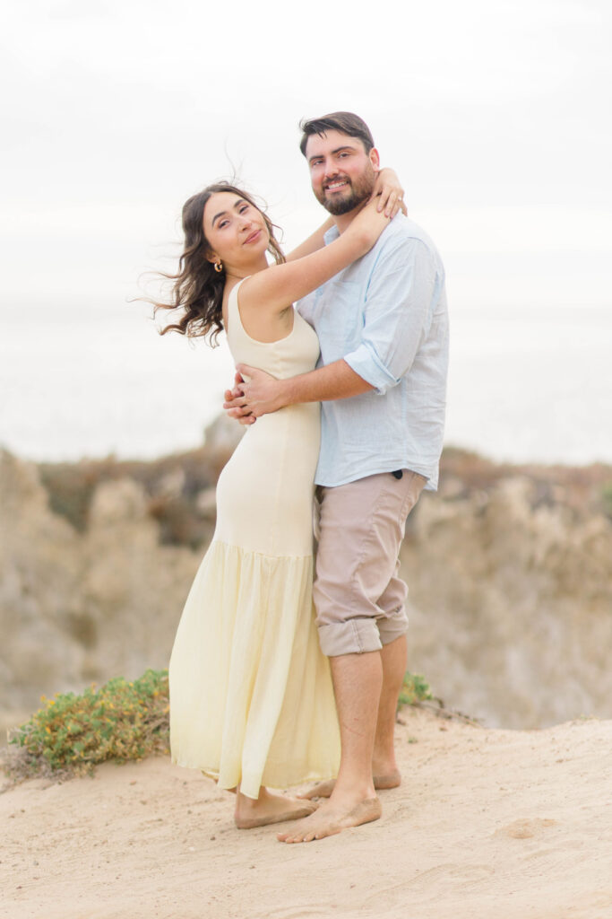 Couple posing at the top of a Malibu Beach