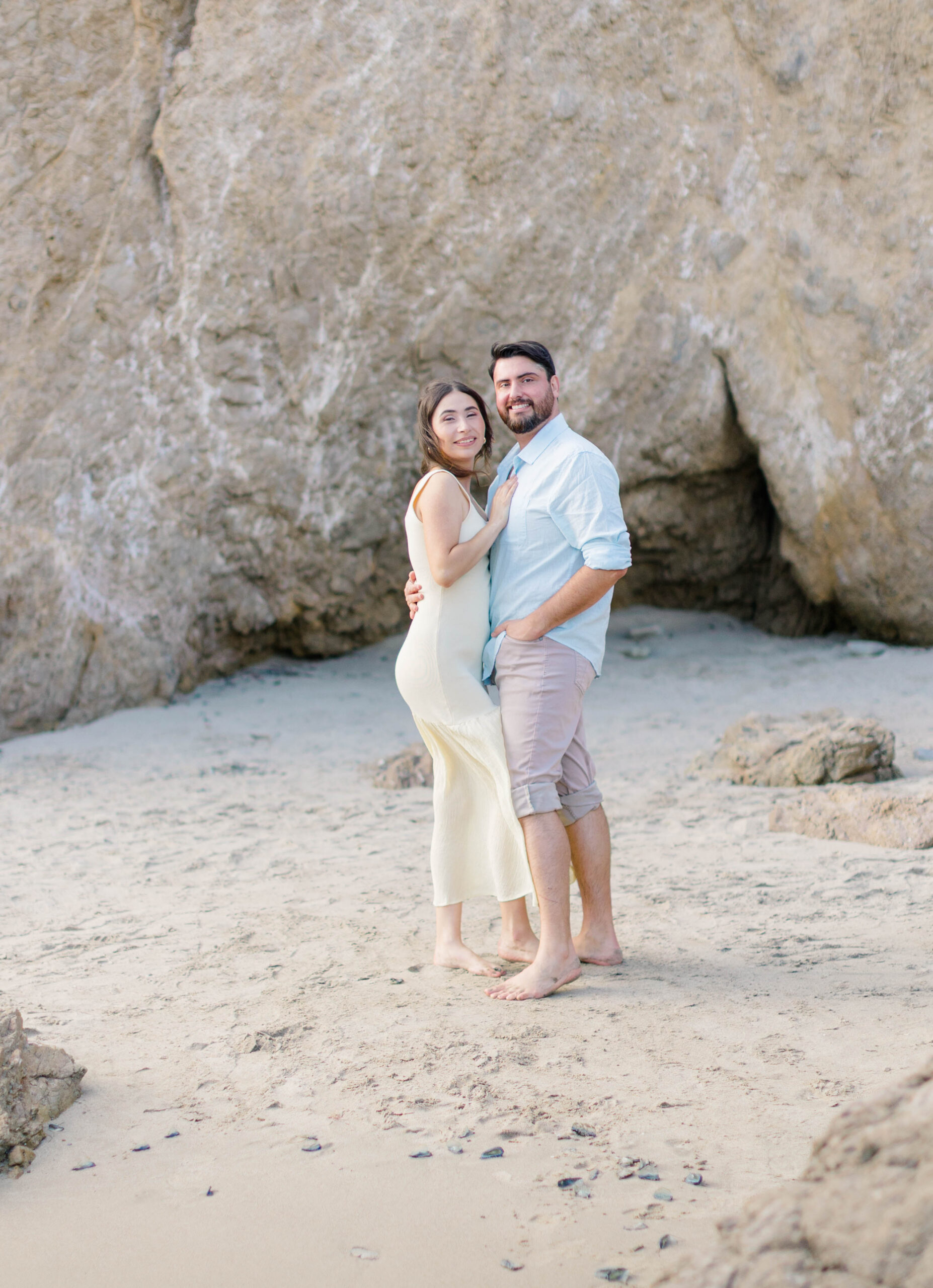 Couple posing at El Matador State Beach in Malibu